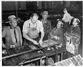 Image of Wanapum visitors in the Seattle Post-Intelligencer composing room, Seattle, October 1956