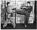 Image of Bruce Lee and Sheldon Wong in martial arts pose, 1961