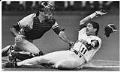Image of Edgar Martinez sliding past Matt Nokes, Seattle, July 16, 1991