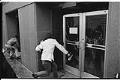 Image of Protesters breaking glass door at Courthouse, February 17, 1970