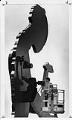 Image of Worker oiling motor for Hammering Man sculpture, Seattle, May 10, 1993