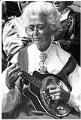 Image of Laila Peterson with mandolin at Syttende Mai, Seattle, May 17, 1988
