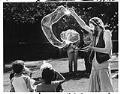 Image of Clown making bubbles at Bumbershoot, Seattle, September 2, 1984
