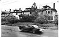 Image of Car passing vacant houses on Capitol Hill, Seattle, April 13, 1982