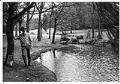 Image of Ranger standing at Polliwog Pond, Camp Long, Seattle, March 7, 1985