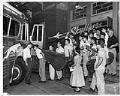 Image of Lotus Skyliners band members boarding bus for tour, Seattle, August 1956