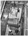 Image of Employees loading bags of bulgur at Fisher Flouring Mills, Seattle, July 24, 1961