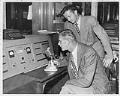Image of Land-based dispatchers calling tug boat captain, Seattle, June 11, 1949
