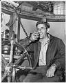 Image of Tug boat captain talking to land-based dispatchers, Seattle, June 11, 1949