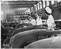 Image of Employees with imported cars at Foreign Trade Zone, Seattle, April 20, 1950