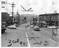 Image of Patrolman handing out Civil Defense evacuation cards, Seattle, May 20, 1955