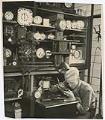 Image of Clock maker repairing clocks at Goodwill, Seattle, November 19, 1933