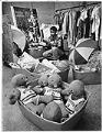 Image of K. C. Curry sorting Sonics souvenirs at Goodwill, Seattle, February 6, 1987