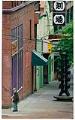 Image of Man walking past Tsutakawa sculpture in Chinatown - International District, Seattle June 29, 1988