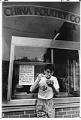 Image of Man eating Chinese BBQ, Seattle, June 29, 1988