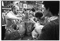 Image of J. B. McCrummen selling produce at U-District farmers market, Seattle, April 23, 1977
