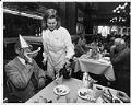 Image of Server pouring coffee for diner at F.X. McRory's, Seattle, December 30, 1990