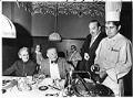 Image of Chef serving diners at Rosellini's, Seattle, December 5, 1975