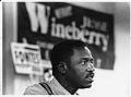 Image of Jesse Wineberry with campaign signs, Seattle, September 2, 1992