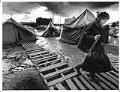 Image of Man removing belongings from Tent City, Seattle, December 10, 1990