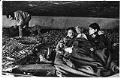Image of Couple sitting under freeway overpass, Seattle, April 14, 1987