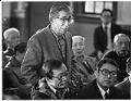 Image of Don Chin talking with city officials after Wah Mee Club massacre, Seattle, February 20, 1983