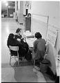 Image of Three people playing cards during Beacon Hill School occupation, October 18, 1972
