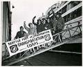 Image of Soldiers waving from gangplank at Port of Embarkation, Seattle, circa 1944