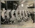 Image of Coolidge Propeller Co. employees posing with large propeller, Seattle, 1911