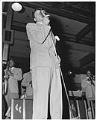 Image of Cab Calloway singing on stage with his orchestra, circa 1947