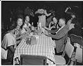 Image of Group of friends around table at a nightclub, Seattle, 1947