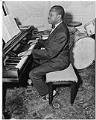 Image of Oscar Holden Sr. at the piano, Seattle, June 9, 1952