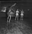 Image of Costumed women dancing, June 22, 1944