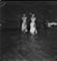 Image of Dancing women in grass skirt costumes, Seattle, June 22, 1944