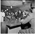 Image of Large group seated at a bar, circa 1947