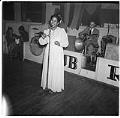 Image of Woman singing in front of a band at Club Rizal, Seattle, March 1, 1944