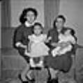 Image of Two women holding babies, Seattle, circa 1953
