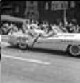 Image of Harvest Festival Queen candidates riding in July 4th parade, Seattle, circa 1953