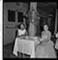 Image of Janice Fair and friend sitting at a table, Seattle, circa 1953