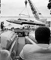 Image of Crane lifting Miss Cadillac out of water, Seattle, circa 1953