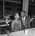 Image of Don and Shirley Phelps sitting at a table at large venue Seattle, circa 1953