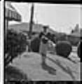 Image of Izzie Smith standing in her front yard, Seattle, circa 1953