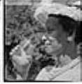 Image of Izzy Smith with drink in backyard, Seattle, circa 1953