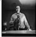 Image of Al Smith taking a self-portrait, Seattle, circa 1953