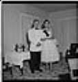 Image of Charles and Claudine Winston posing in semi-formal attire, Seattle, circa 1953
