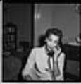Image of Izzie Smith talking on the phone, Seattle, circa 1953