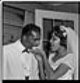 Image of Bride and groom eating cake, Seattle, September  27, 1959
