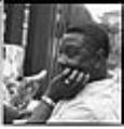 Image of Howard Allen sitting in backyard, Seattle, circa 1953