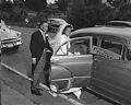 Image of Deloris and Rhone Berry entering car on their wedding day, Seattle, June 15, 1952