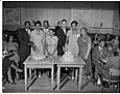Image of Newlyweds cutting cake at a double wedding, Seattle, circa 1950